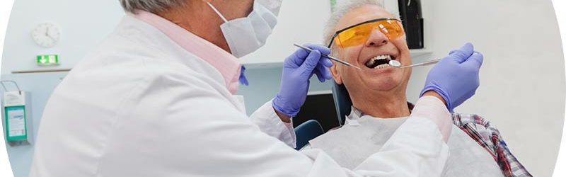 Header image of dentist and patient