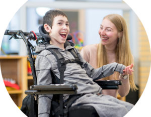 Header image of disabled boy and carer