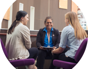 Header image of Indigenous manager and staff sitting