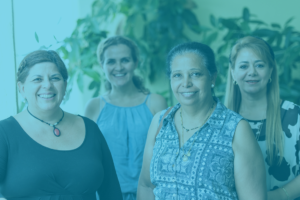 QIP blue header image of four women of different ages and backgrounds looking at camera and smiling