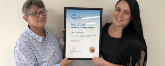 Image of Carers Queensland staff with Certificate